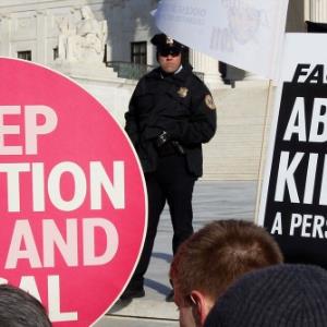 Are protests outside abortion clinics an expression of free speech or harassment of women?